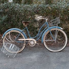 Vintage Shelby "Safe-T-Bike" Girl's Bicycle in Original Finish: A vintage Shelby Safe-T-Bike girl’s bicycle. This mid-century bicycle features an air-flow design, white wall tires, an original head badge, and three wire baskets. It also retains its original light blue and white finish with silver-tone metal accents.
