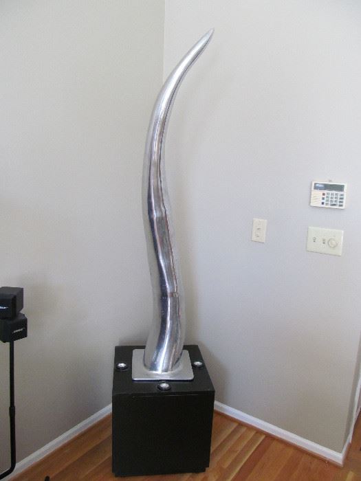 Aluminum "Horn" sculpture with lighted base