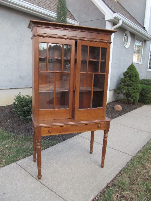 Antique plantation desk with glass-paned doors