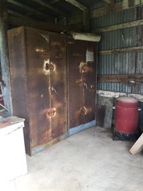 Two rusty gold storage shelves and vintage smoker