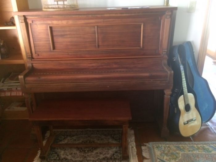 ANTIQUE AUTOTUNE PLAYER PIANO IN WORKING ORDER.  NEEDS TUNING AND HAS LOTS OF MUSIC ROLLS!