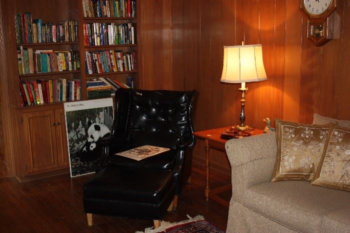 Vinyl chair and ottoman, books