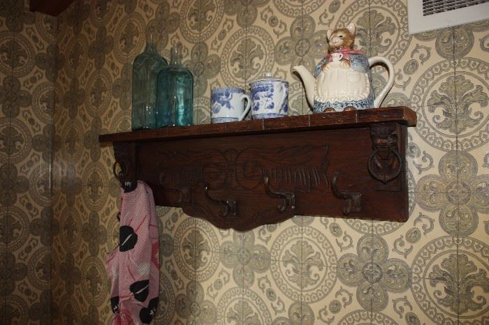Antique shelf with hooks