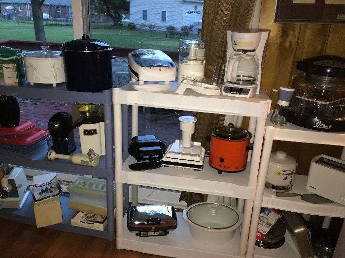 At least one and in some cases multiples of every small kitchen appliance. Coffee pots, blenders, crock pots, can openers, coffee bean grinder, meat grinder, mixer, dehydrator, George Foreman grills, waffle maker, hot air popcorn maker, ice cream maker and more!