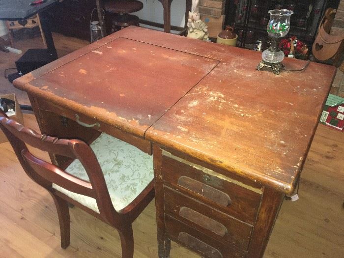 very old typing table with three drawers on right side
