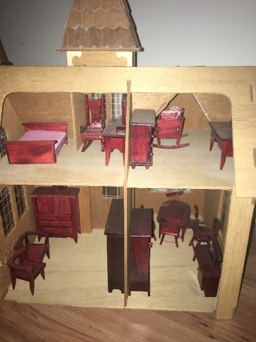 inside back of wood doll house with miniature doll furniture. great condition!