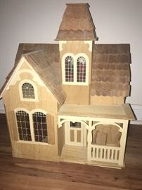 beautiful wood doll house ( does have a collection of miniature doll furniture inside)
