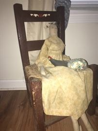 old chair with hand made doll