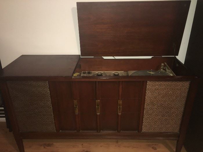 old record player with radio -does work , plays 45's and 33's and has great sound with A.M. and F.M. dials . does have storage space for albums .