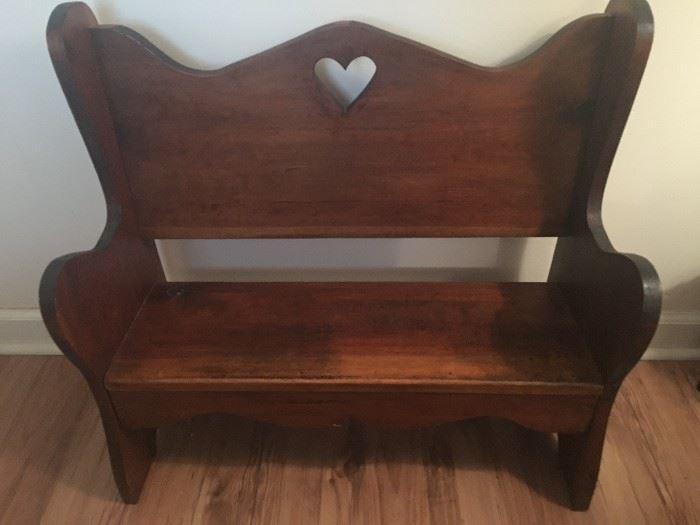 primitive bench with heart shape in back 