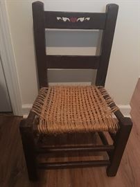 child's chair made with twine seat and hand painted back