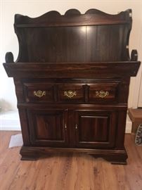 nice serving buffet with three pull out drawers and two bottom doors
