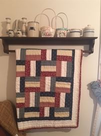 nice quilt rack holder and shelf with pottery and baskets