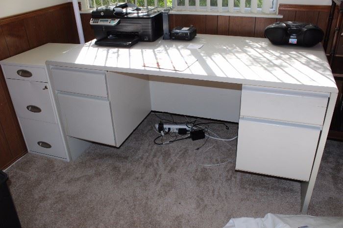 White desk and filing cabinet.
