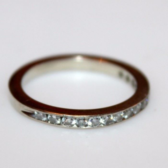 14K White Gold and Diamond Ring: A white gold and diamond band.