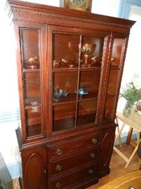 Mahogany china cabinet filled with carnival glass; Northwood, Imperial and Fenton