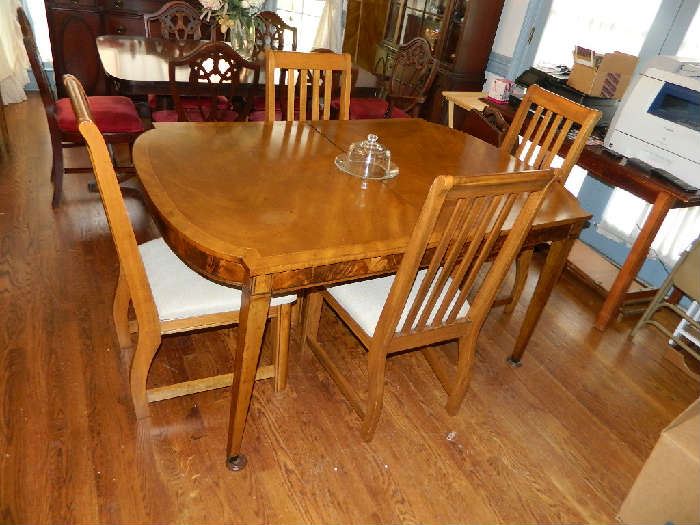 We have a super nice dining table and four chairs!