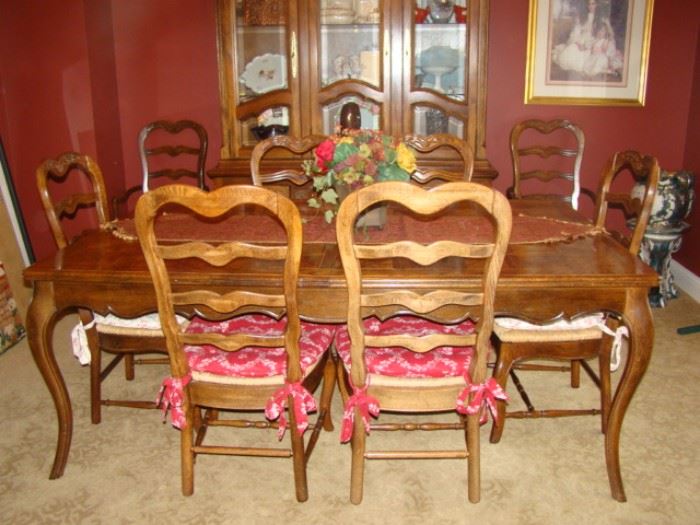 Dining room table with 8 chairs and 2 leaves.  Matching cabinet available.  