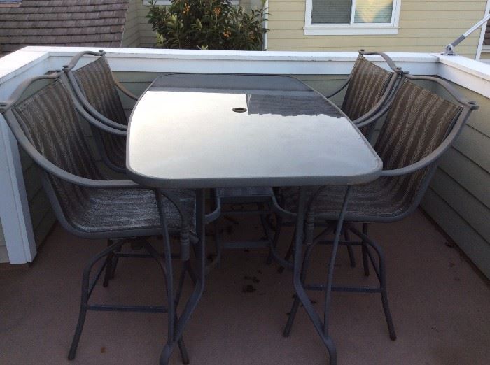 Bar height patio table and 4 chairs - this has an umbrella