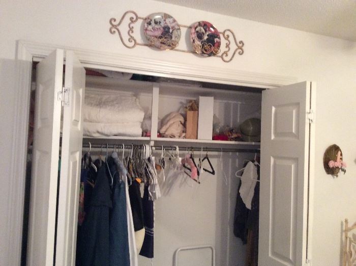 More linens and clothing, above are pug plates in a great holder. 