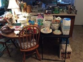 Dining table with 5 chairs, all kinds nds of small appliances, cookware, glasses, dishes, etc