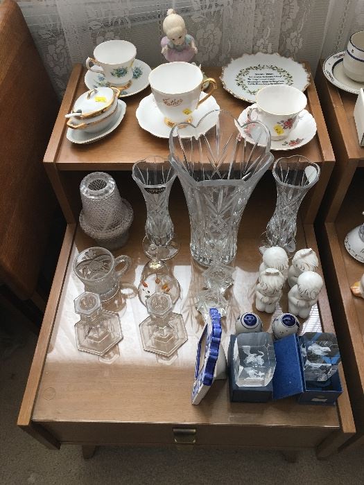 Misc vintage cups and saucers.  Glassware on more mahogany side tables