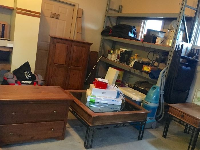 Nice furniture in this garage. Coffee table, chest, large armoire, side table. Also shelving.