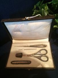 Art Noveau 5-piece sterling sewing kit in leather case
