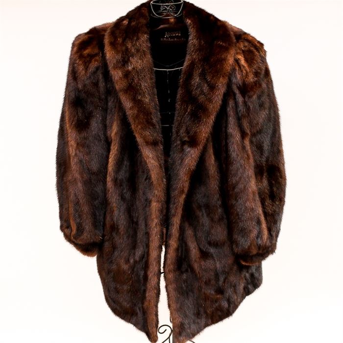 Koslow's Mink Fur Coat: A women’s fur coat. The group features a genuine mink fur collared coat crafted by Koslow’s with the manufacturer’s tag sewn to the interior.