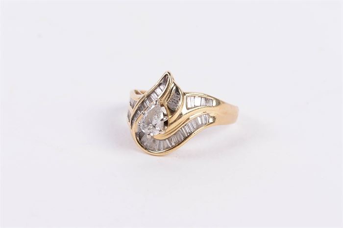 14K Yellow Gold Ring with Diamonds: A 14K yellow gold ring with diamonds.
