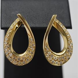 Bideas 14K Yellow Gold Diamond Dangle Pierced Earrings: A pair of 14K yellow gold diamond dangle pierced earrings by Bideas. Earrings feature a diamond embellished arched design, with a pierced push back post.