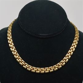 14K Yellow Gold Panther Chain Necklace: A 14K yellow gold panther chain necklace. Chain features a paver design with a flat back, and is secured with a hidden box table an figure eight safety.