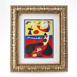 1938 Joan Miro Lithograph "L'Ete": A 1938 Joan Miro lithograph titled L’Ete. This lithograph on paper depicts an abstract beach scene and is signed in plate. Presented under glass, with matting, and in a gilt colored carved wood frame which is ready to hang with a wire hanger on the backside. A certificate of authenticity is attached to the backside.