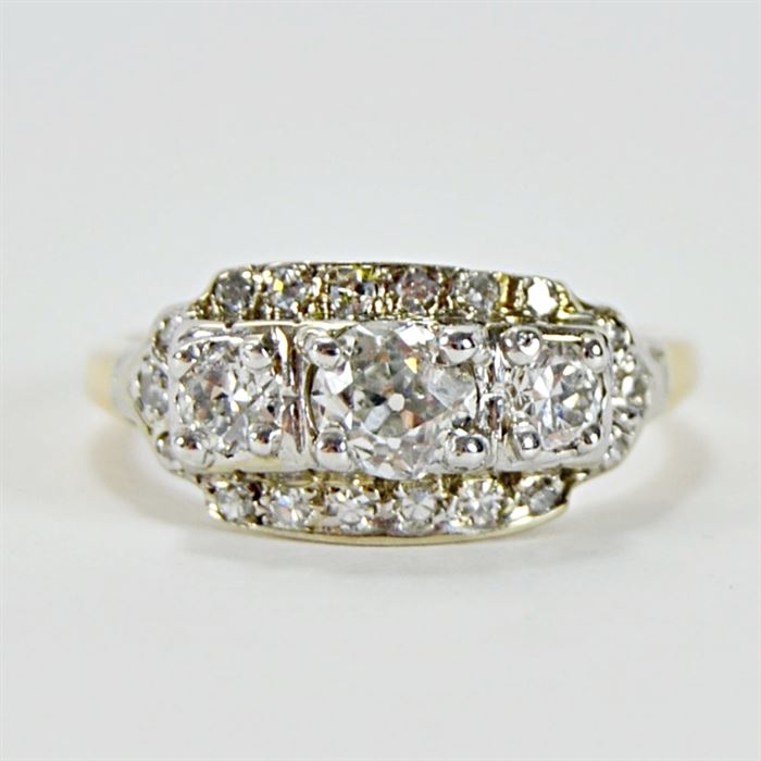 1.06 CTW Diamond Engagement Ring: A 1.06 ctw diamond engagement ring in an antique style 14K gold setting.
