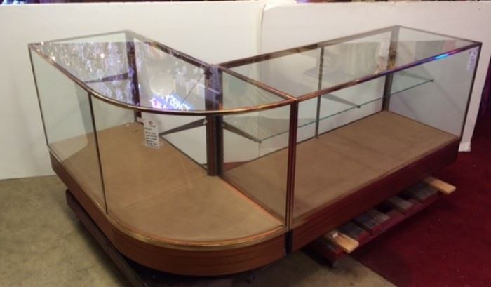 Bronze and wood curved glass showcases