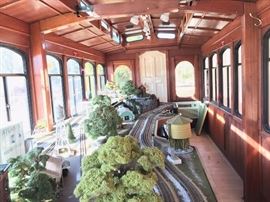 Interior of Trolley with train set and scale city scape of Hapeville, Georgia.