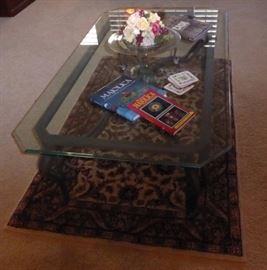 Glasstop coffee table..iron base