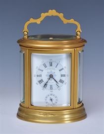 Grande Sonnerie Carriage Clock	
quarter hour repeater
signed V. J. Magnin, Guédin & Co, New York
5 1/2" high (excluding handle)
late 19th century