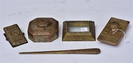 Tiffany Studios Bronze Partial Desk Set	
Zodiac pattern
consisting of ink well, blotter, clip,
letter opener, paper weight perpetual calendar