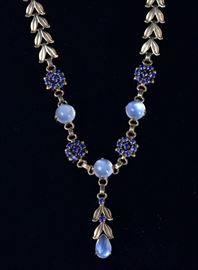 Tiffany & Co. 14k Gold Necklace	
set with moonstones and sapphires
15" long, 21.7 dwt
