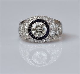 14k Gold Diamond and Sapphire Ring	
with approximately 1.6 ct center diamond
surrounded by sapphires and diamonds
ring size 6 1/2, 3.6 dwt gross