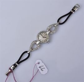 Platinum and Diamond Ladies Wrist Watch	
Tavannes
the watch and two diamond links, 2 1/8" long
5" long overall