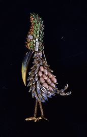 18k Gold Enameled Toucan Brooch	
with coral and diamond feathers, a diamond
eye and enameled beak and feathers
3" long, 15.8 dwt gross
