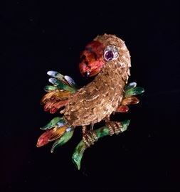 18k Gold Enameled Parrot Brooch	
with ruby and diamond eye
the beak, feathers and branch enameled
2" long, 10.5 dwt gross
stamped Italy