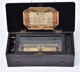 M.J. Paillard Cylinder Music Box	
playing six tunes
8" cylinder
with inlaid case
late 19th century