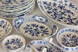 Meissen China	
Blue Onion pattern
associated group including 2 gravy boats,
9 dinner plates, 9 3/4" diameter and
12 pierced dessert plates, 6" diameter
34 pieces
of various dates, all with cross swords marks