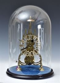 English Skeleton Clock	
15" high (clock)
together with glass dome
late 19th century