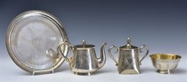 Russian Sterling Silver Four Piece Tea Set	
consisting of teapot and sugar, each 5 1/2" high,
salver, 10 1/2 diameter and catch bowl, 2 1/2" high
55 troy ounces