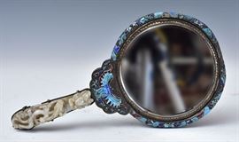 Chinese Enameled and Jade Mounted Hand Mirror	
enameled with birds and flowers
with dragon jade handle, formerly 
a belt hook, 5" long, 13 1/2" long overall