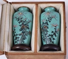 Pair of Japanese Cloisonne Vases	
Floral decoration on a blue ground
4 7/8" high
with brass rim and base